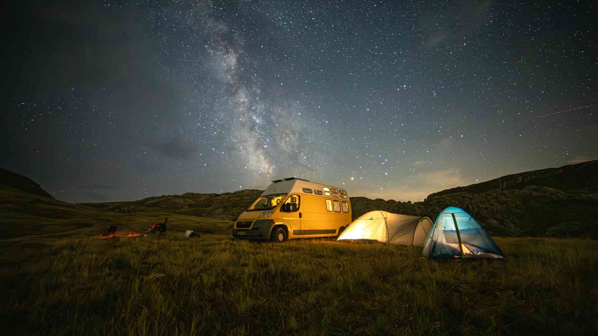 Camping beside a vehicle