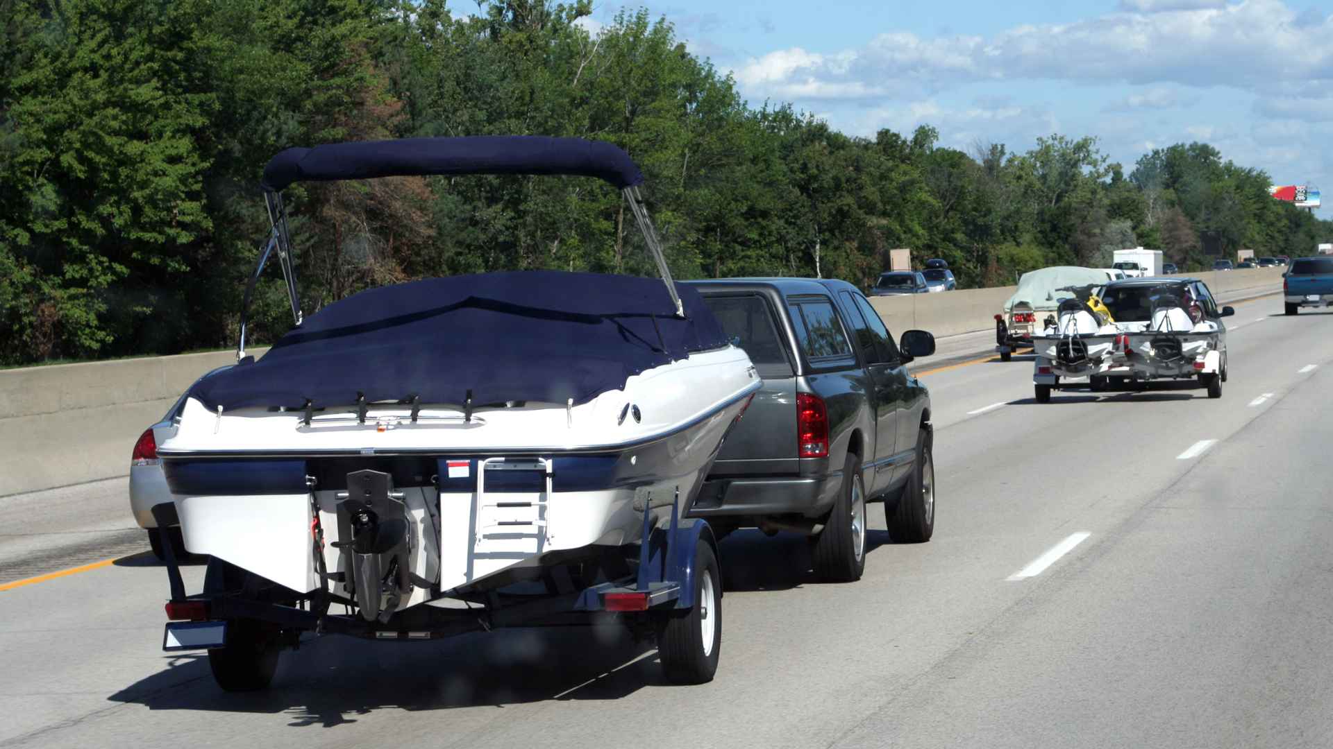 Car with boat on a boat trailer