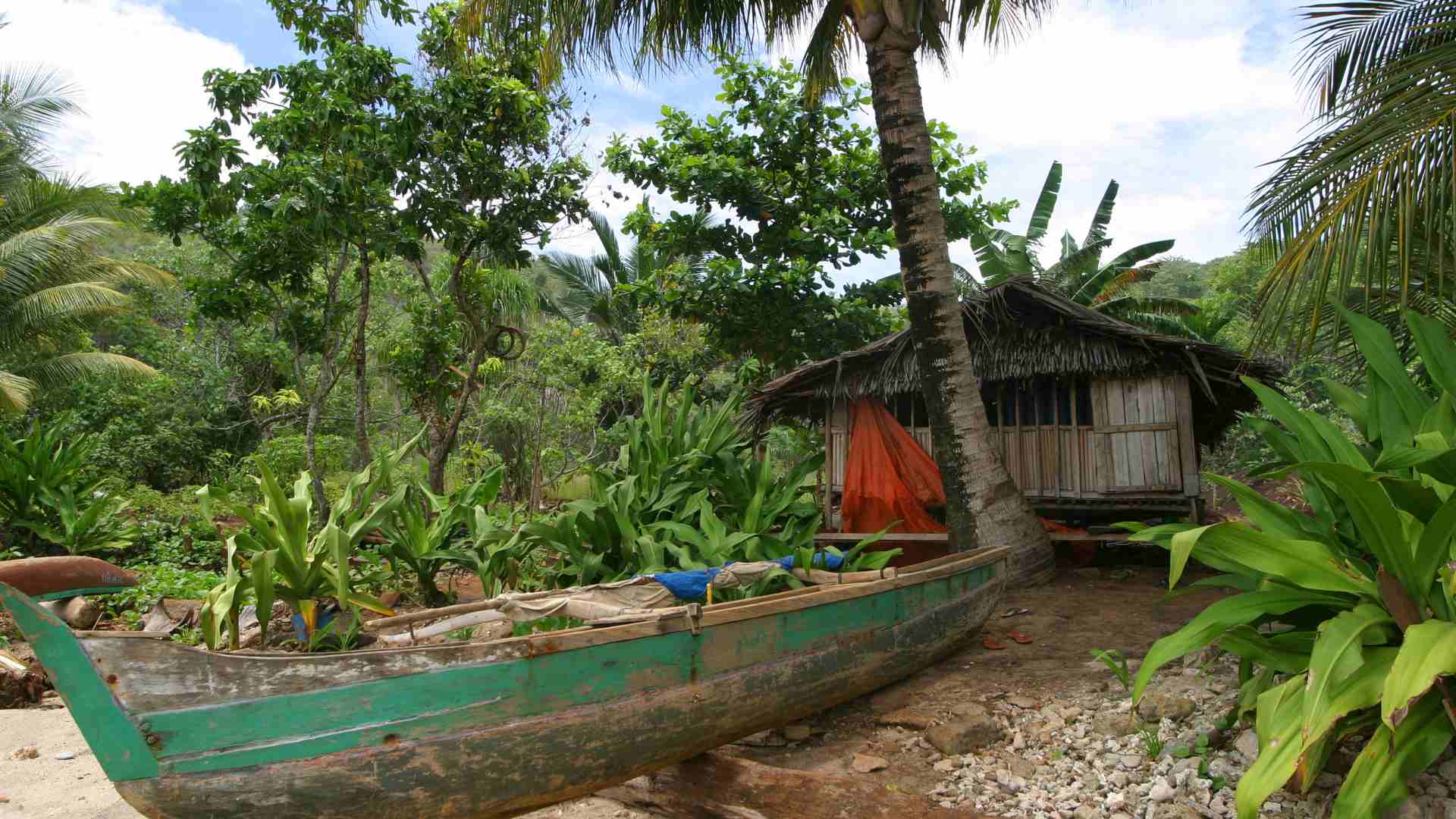 A local house with a boat- typical for Ramu River area